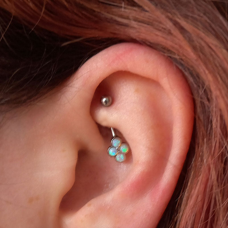 curved barbell with 4 opals in rook piercing
