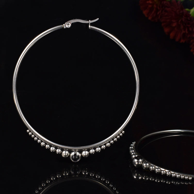 very large hoop earrings, silver steel, tribal dots design with Onyx stone