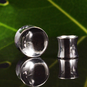 Steel flesh plugs with concave mirror