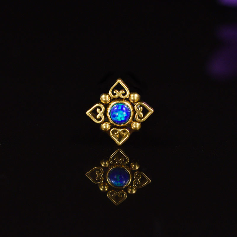 gold filigree tribal labret, heart mandala surrounding a deep blue opal