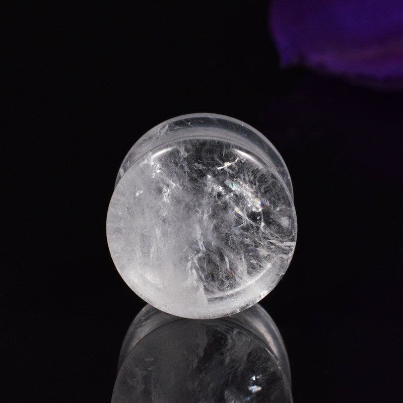 Quartz stone flesh plug on a black background