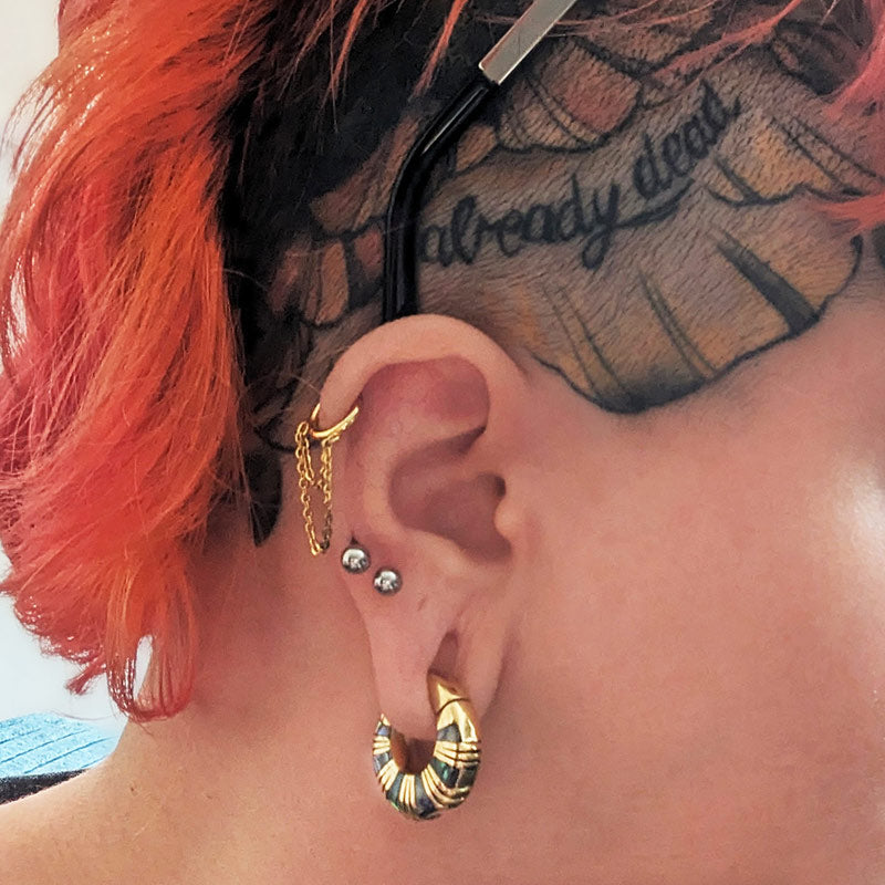 stretched ears head tattoos red hair