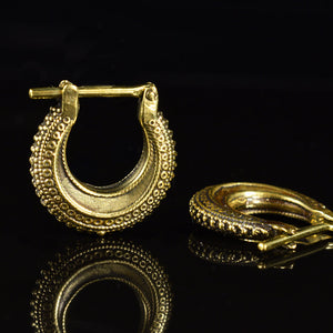 huggy style tribal earrings in golden brass