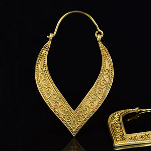 Indian earrings in golden brass in a petal design