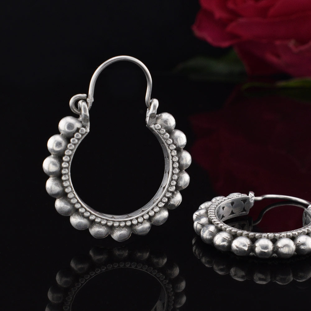 silver brass tribal hoop earrings with balls around the edge