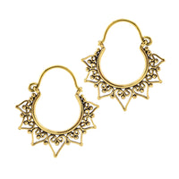 A pair of golden brass heart filigree hoop earrings with ornate openwork detailing and a scalloped triangular heart design, shown on a plain white background.