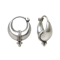 A pair of polished sterling silver Indian crescent-shaped hoop earrings with a textured twisted band and small beads, shown on a plain white background.