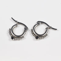 surgical steel tribal style earrings with dots and black ony stones