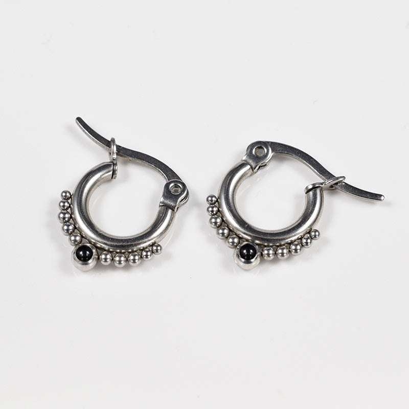 surgical steel tribal style earrings with dots and black ony stones
