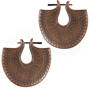 wooden earrings with an engraved mandala design