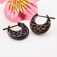 wooden stick or pin earrings. Ornate spiral design 