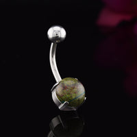 Navel Bar with dark green african jade stone on black background