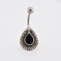 A sterling silver ended navel bar / belly button  ring with a teardrop-shaped shield featuring a black Onyx teardrop center and a border of small silver dots, shown on a plain white background.