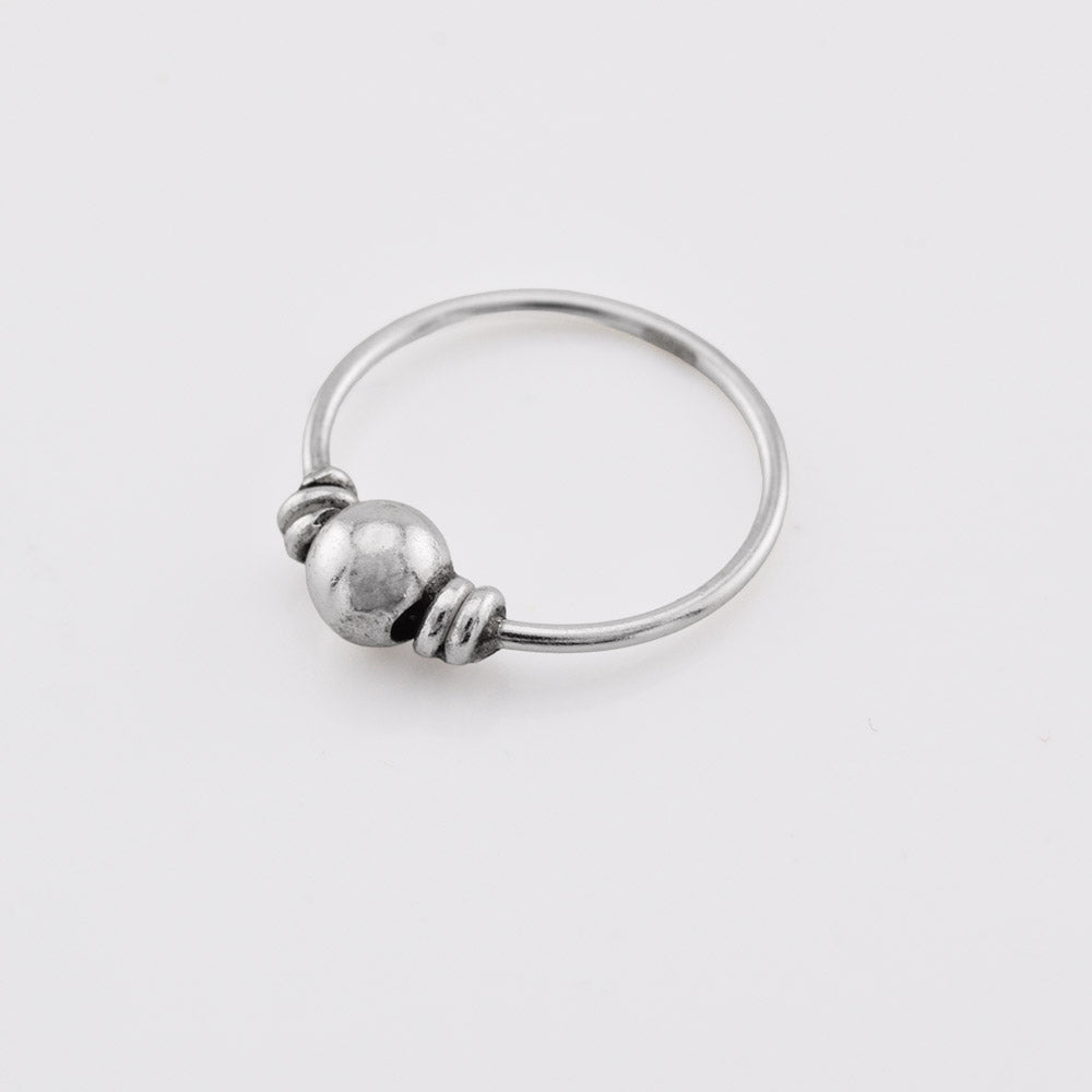 silver nose ring with a small bead