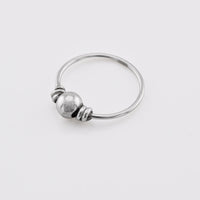 silver nose ring with a small bead