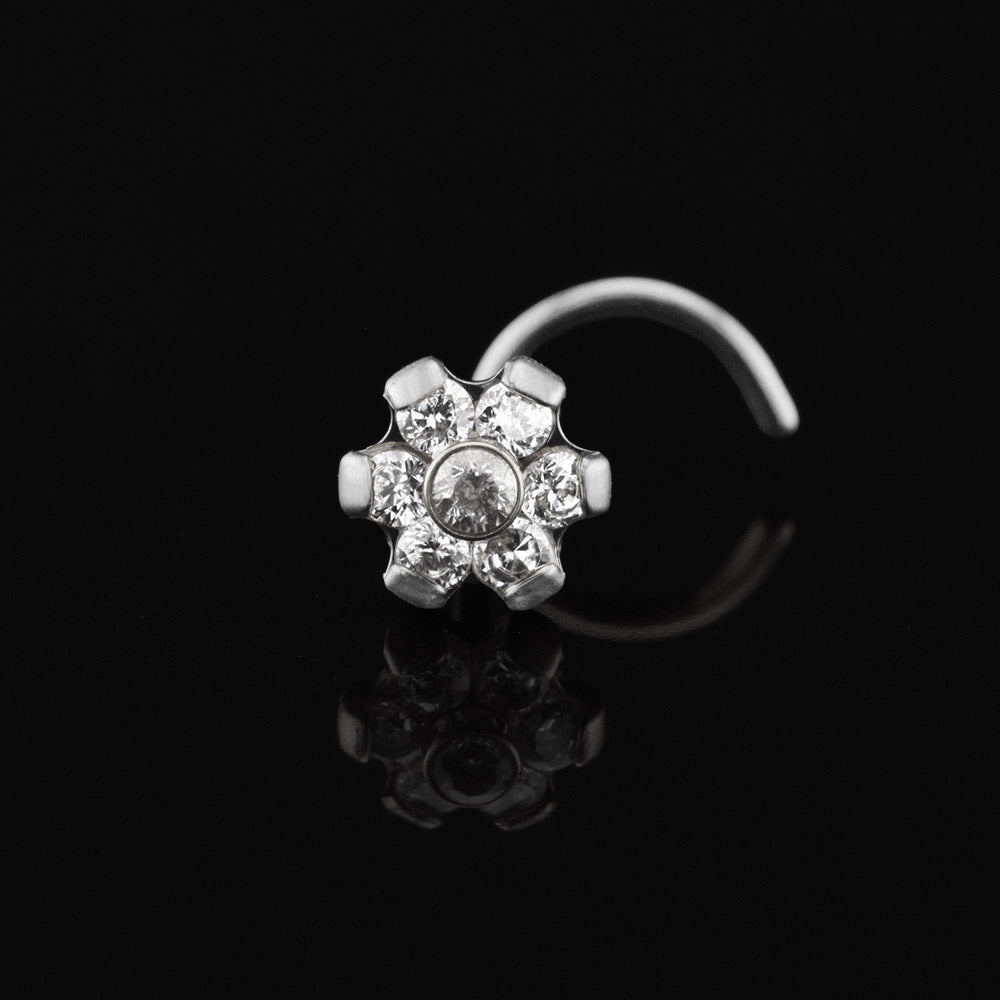 titanium nose stud with prong set crystals in a flower design