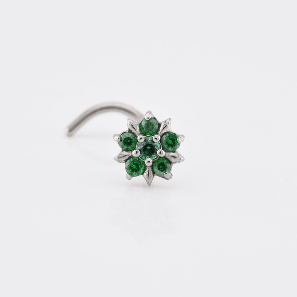 Nose screw wirh emerald green cubic zirconia stones set in a flower design on a white background