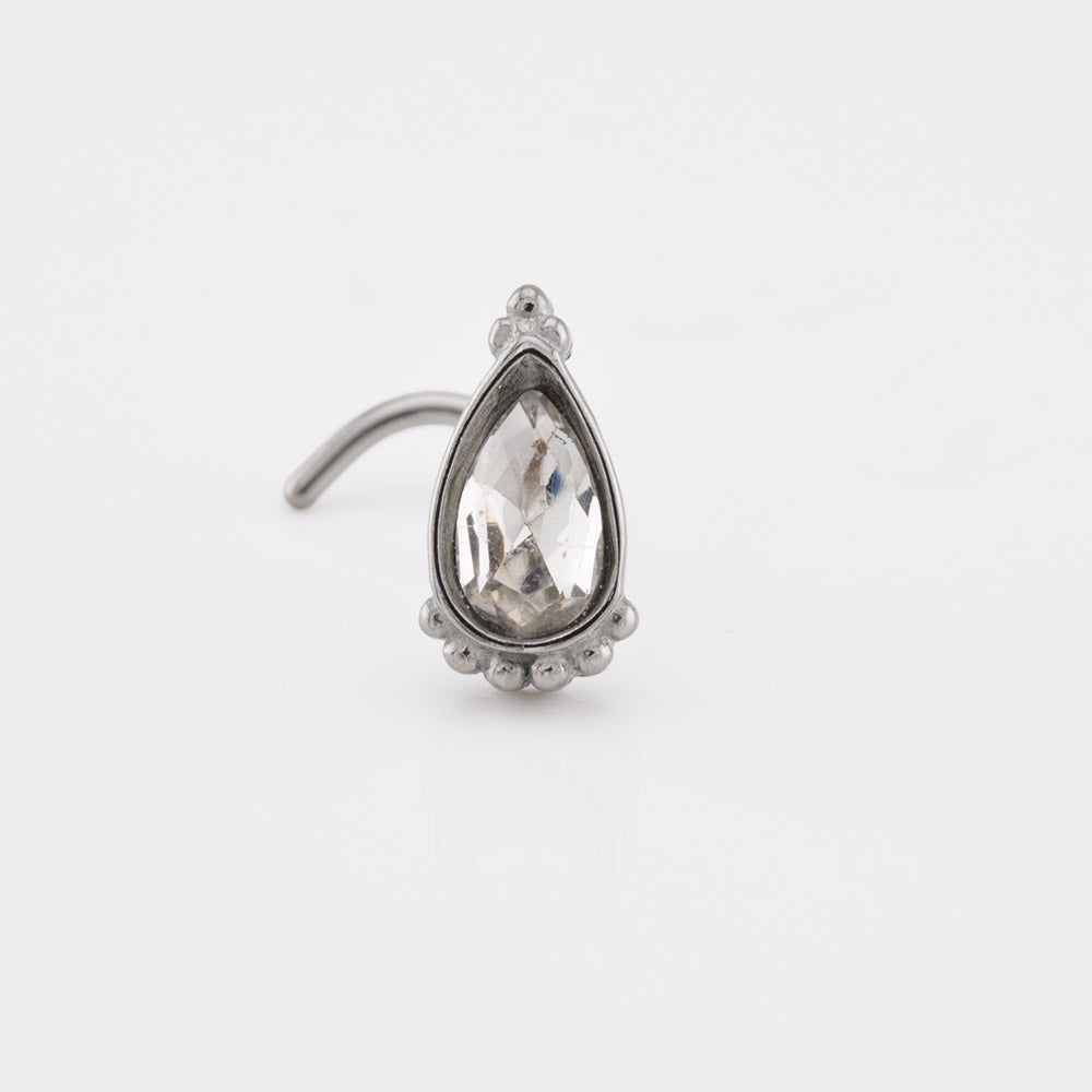 Indian nose stud with teardrop crystal decorated with tribal beads on white background
