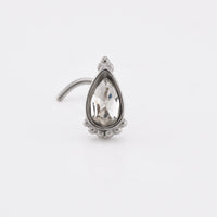 Indian nose stud with teardrop crystal decorated with tribal beads on white background