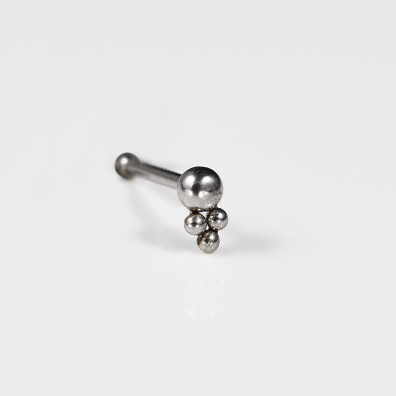 nose stud with three dots