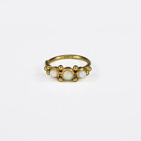 gold coloured tribal Indian nose ring with dots and opal stones
