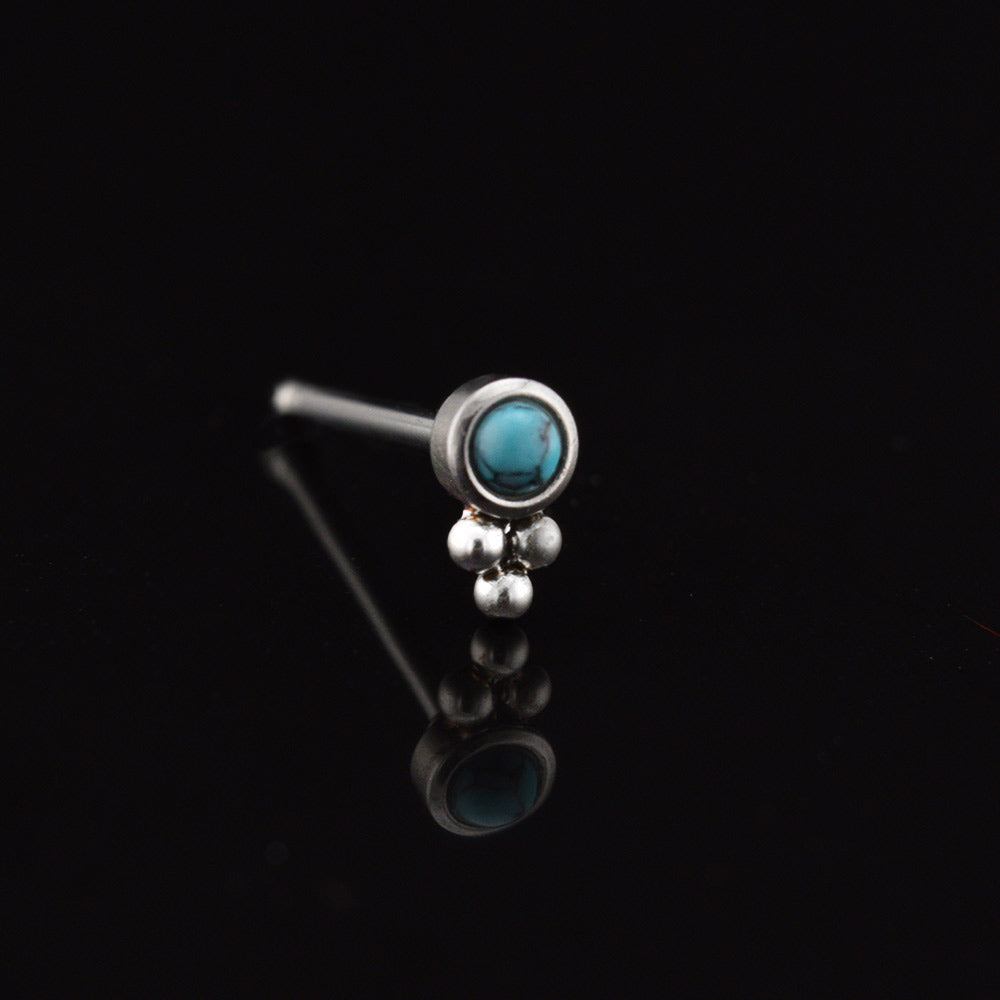 tribal style nose stud with turquoise stone and triple dots