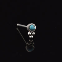 tribal style nose stud with turquoise stone and triple dots