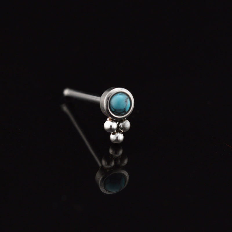 tribal style nose stud with turquoise stone and triple dots