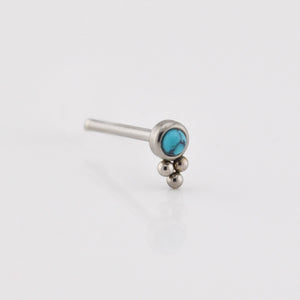Silver nose ring with turquoise stone on a white background