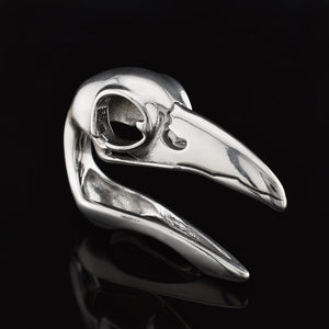 bird skull gothic ear weight in surgical steel on a black background