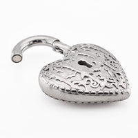 A silver-toned heart-shaped padlock earweight with intricate filigree cutouts of bats and a curved magnetic clasp, shown open on a plain white background.