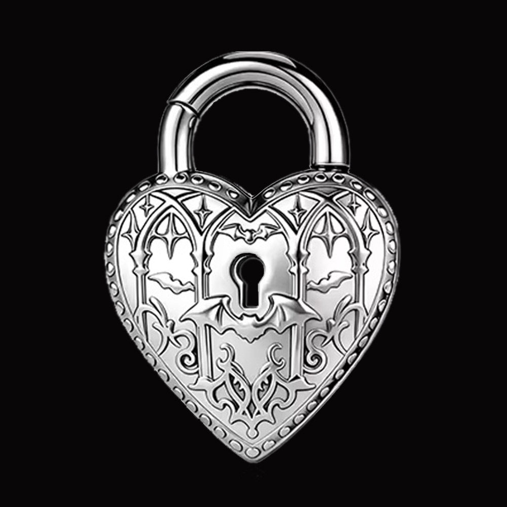Gothic Ear Weights in the shape of a heart padlock decorated with bats and vaulted architecture on a black background