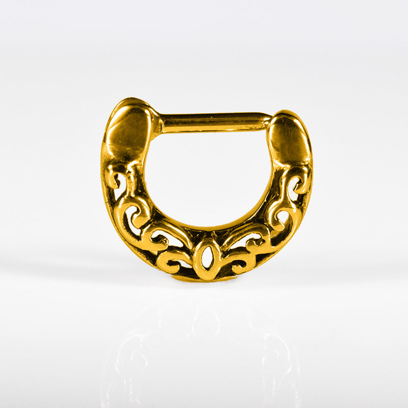 small gold septum clicker with filigree design fits snug around the septum
