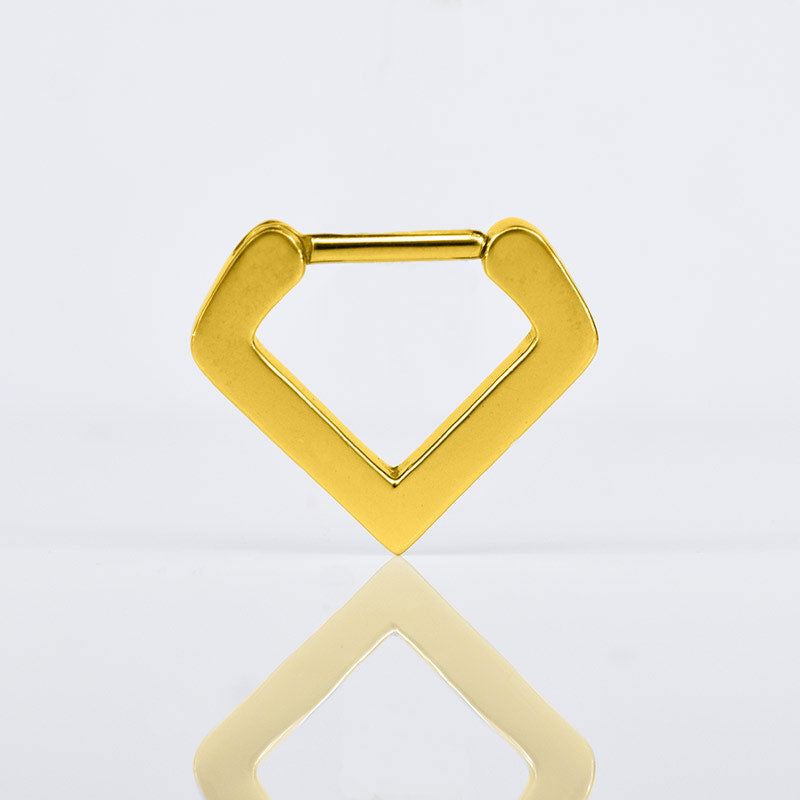 v shape septum clicker ring in gold steel on a white reflective background
