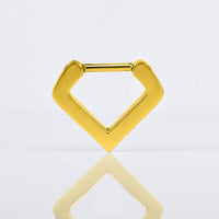 v shape septum clicker ring in gold steel on a white reflective background
