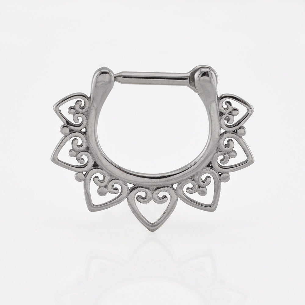 Septum clicker ring in silver toned steelwith a hearts design around the ring on a white background