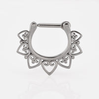 Septum clicker ring in silver toned steelwith a hearts design around the ring on a white background
