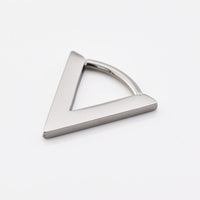 V shape septum clicker ring in surgical steel on a white background