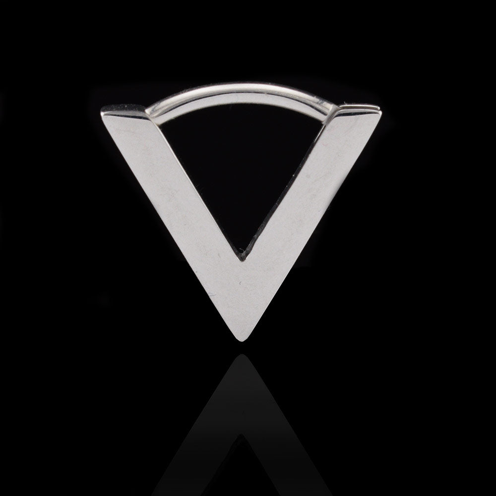 V shape septum clicker ring in surgical steel on a black reflective background