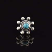 silver threadless end, tribal dots surrounding turquoise stone