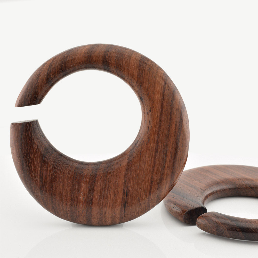 Wooden ear hanger hoop earrings on a white background