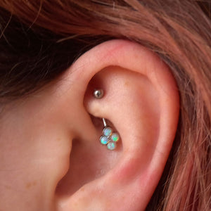curved barbell with 4 opals in rook piercing
