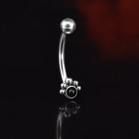 curved barbell with black onyx stone and tribal dot curve