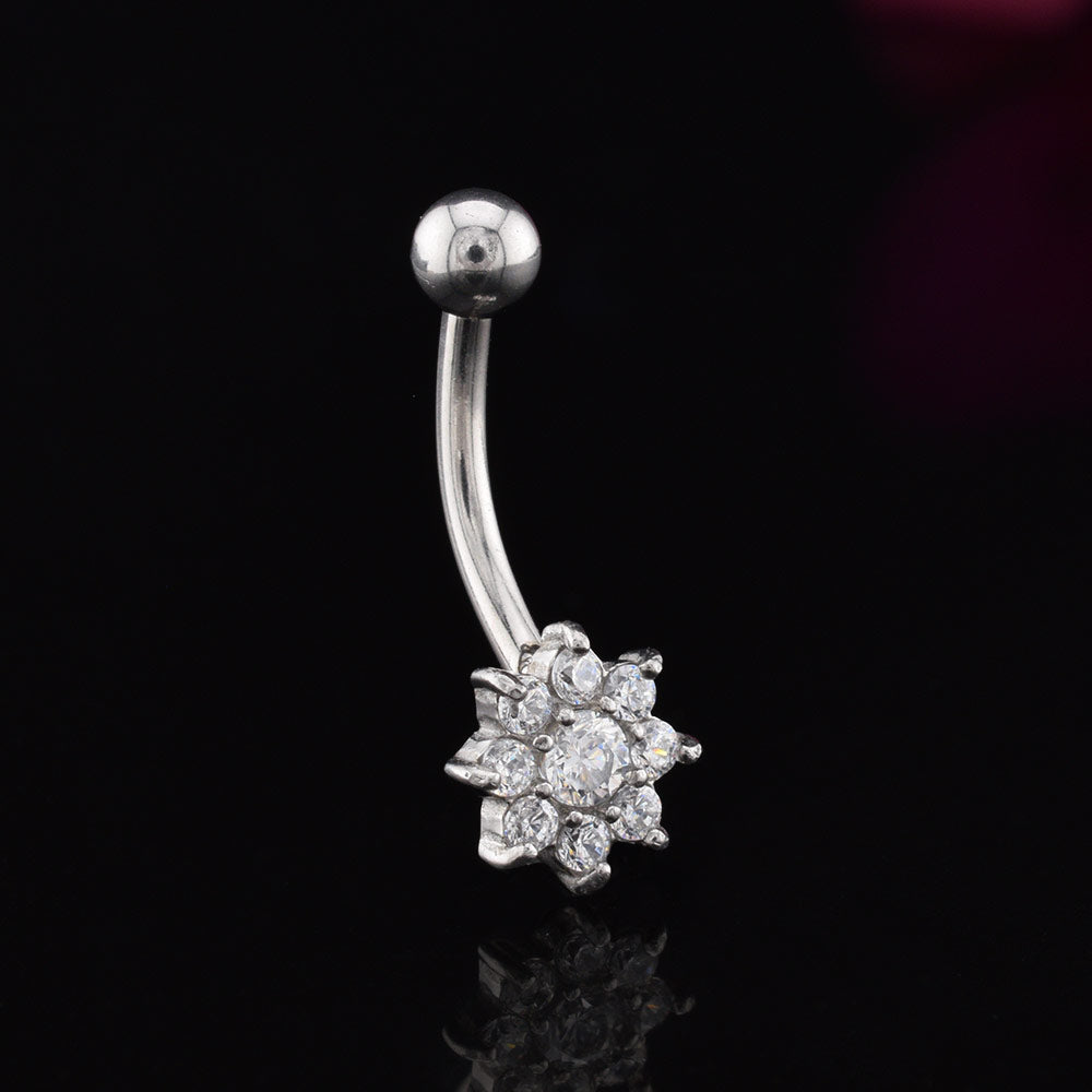 curved barbell with cluster of CZ cubic zirconia stones in a flwoer design on a black background