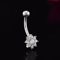 curved barbell with cluster of CZ cubic zirconia stones in a flwoer design on a black background