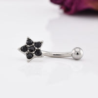 curved barbell with black stones in a star design