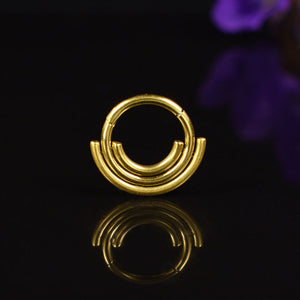 gold hinged segment ring with triple rings tragus, helix, daith