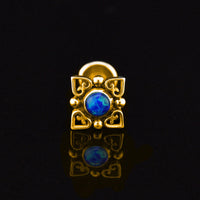 gold colour labret with heart filigree and deep lue opal stone
