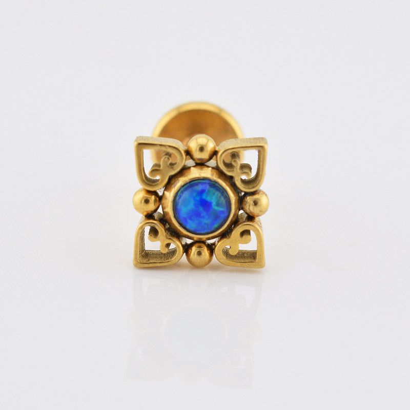 internally threaded gold labret with deep blue opal stone