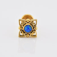 internally threaded gold labret with deep blue opal stone